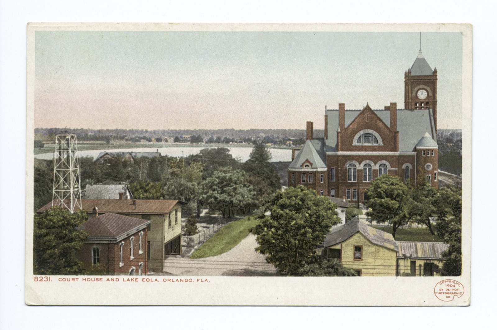 An early 1900s postcard of the Orange County courthouse with Lake Eola behind it